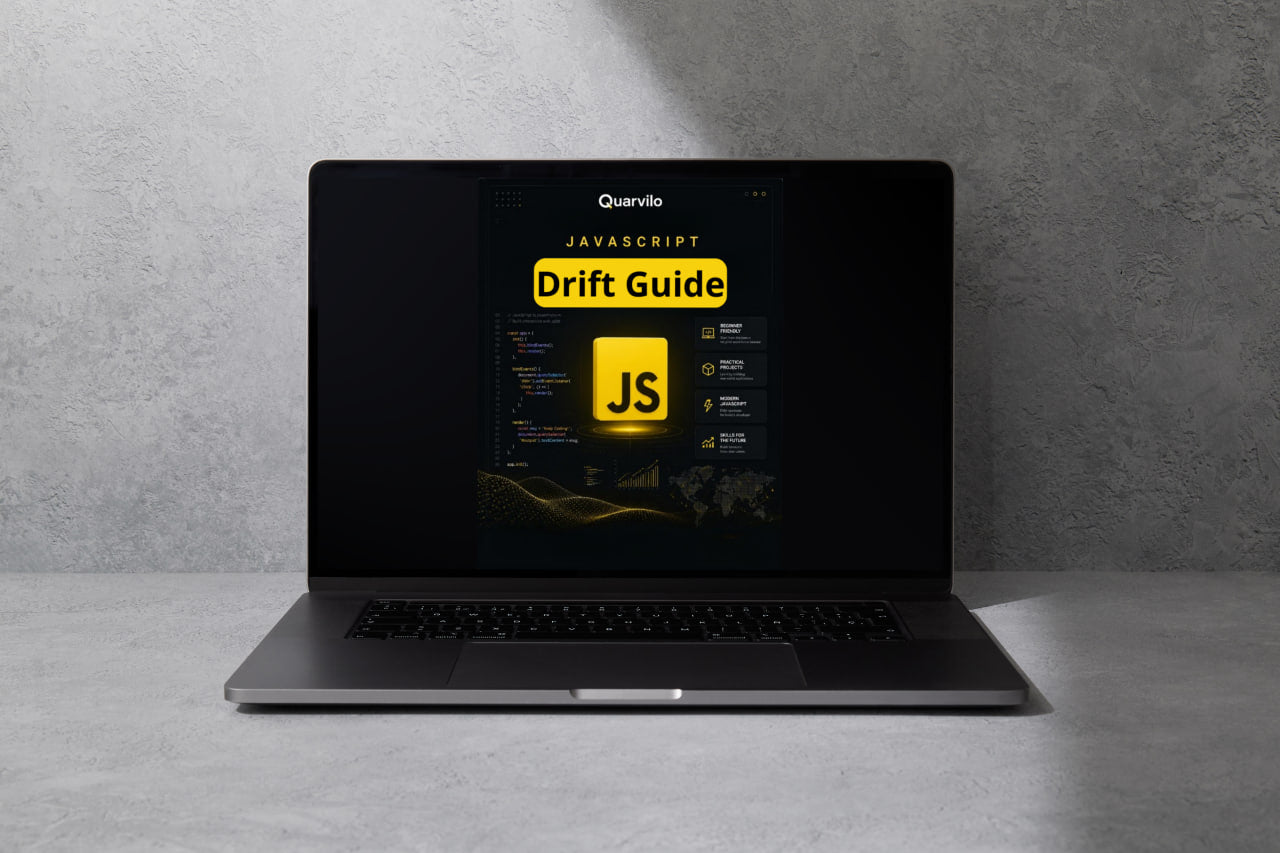 Laptop displaying a Quanvil JavaScript Drift Guide on a gray background